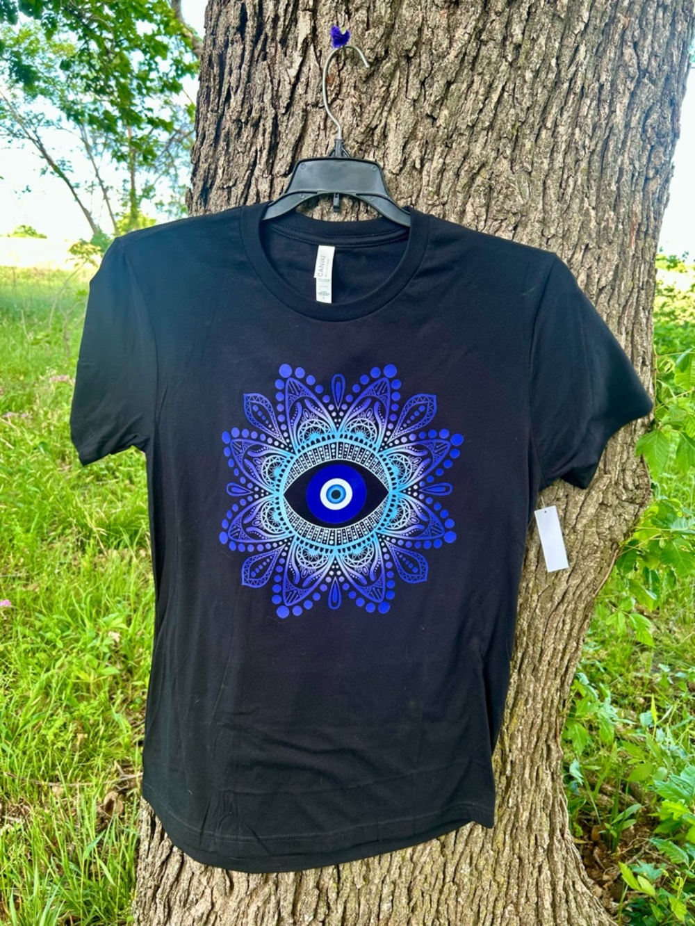 Black Women’s T‑Shirt with Blue Evil Eye Graphic